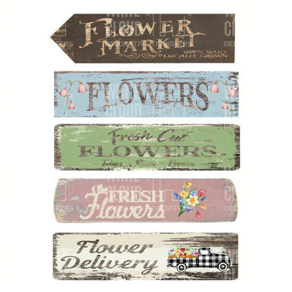 Set of wooden signs with floral-themed text on a white background