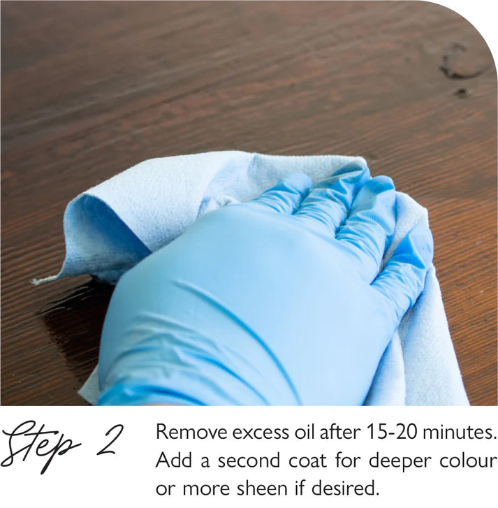 Fusion Stain & Finishing Oil White Hand wearing a blue glove holding a brush on a wooden surface with text about removing excess oil.