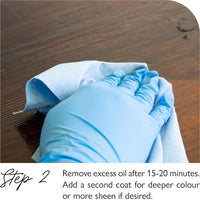 Fusion Stain & Finishing Oil White Hand wearing a blue glove holding a brush on a wooden surface with text about removing excess oil.