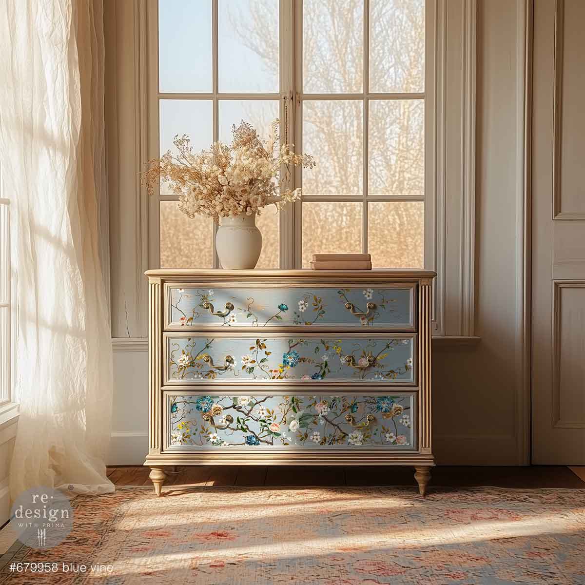 Redesign transfer Large Blue Vine Decorative chest of drawers with floral patterns in a room with large windows.