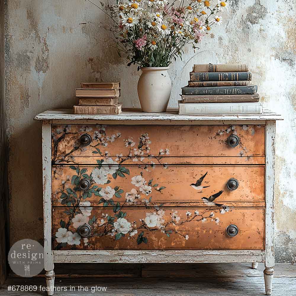 Feathers in the Glow A1 Fiber Paper 1 sheet Vintage dresser with floral and bird designs, books, and a vase of flowers on top against a textured wall.