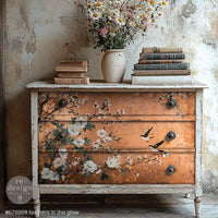 Feathers in the Glow A1 Fiber Paper 1 sheet Vintage dresser with floral and bird designs, books, and a vase of flowers on top against a textured wall.