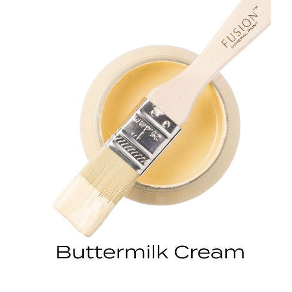 Buttermilk Cream paint with a brush on a white background Fusion