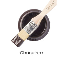 Fusion Mineral Paint brush with chocolate color swatch on a white background