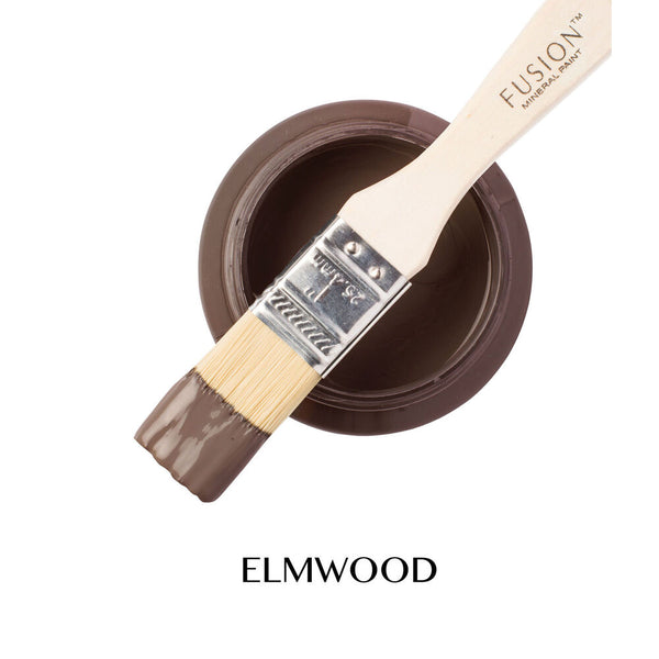 Fusion Mineral Paint brush with a container of Elmwood paint on a white background