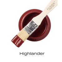 Paint brush with red paint and 'Fusion Mineral Paint' branding on a white background