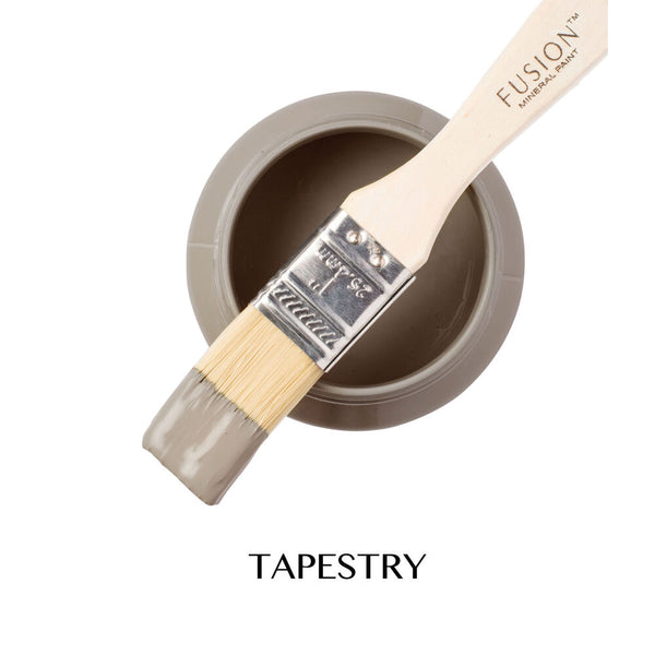 Fusion paintbrush with a container of 'Tapestry' paint on a white background