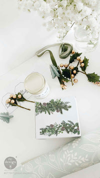 Redesign with Prima transfer middy Gilded Elegance 4 sheet Decorative table setting with floral arrangements and a card on a white surface.