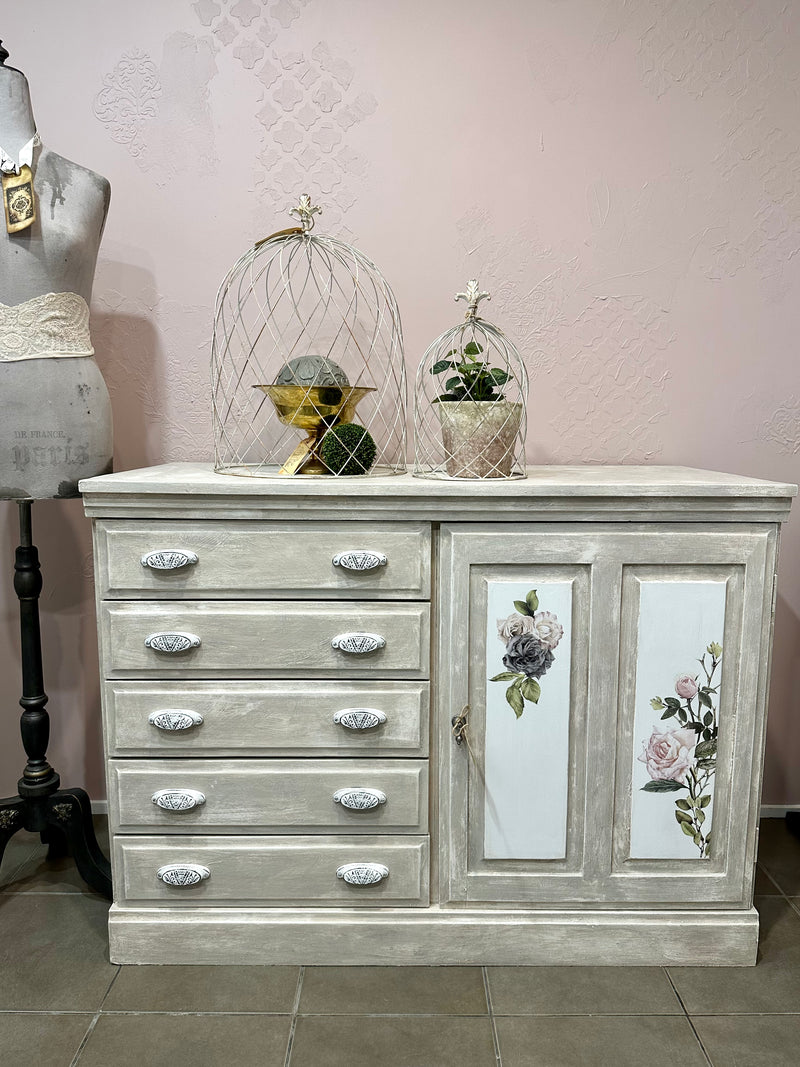 Using the Chateau method layering paint and wax has created this unique Olde Worlde look on this solid sideboard. Shades of grey, white and floral transfers complete the look, Dimensions approx 900mm height x 1200mm length.