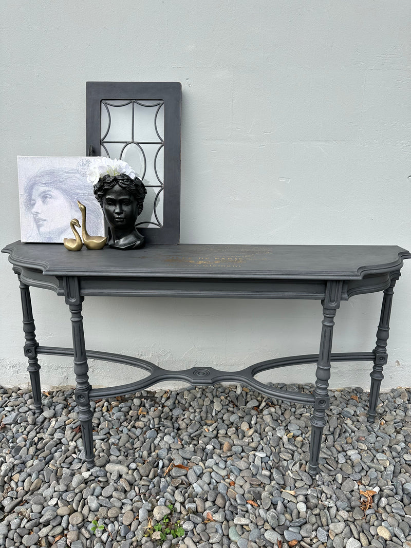 This delicate hall table is a slim width with very detailed legs. We amped this up with some gold foil scrip on top. Totally bespoke.  Dimensions 320mm depth x 1200mm length x 610mm height