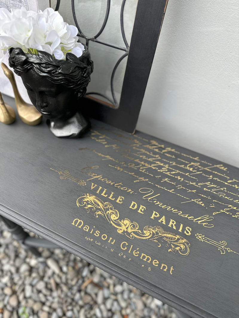 This delicate hall table is a slim width with very detailed legs. We amped this up with some gold foil scrip on top. Totally bespoke.  Dimensions 320mm depth x 1200mm length x 610mm height