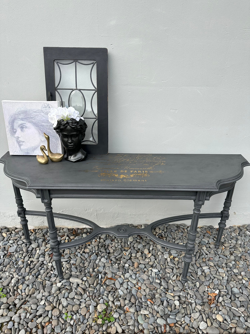 This delicate hall table is a slim width with very detailed legs. We amped this up with some gold foil scrip on top. Totally bespoke.  Dimensions 320mm depth x 1200mm length x 610mm height