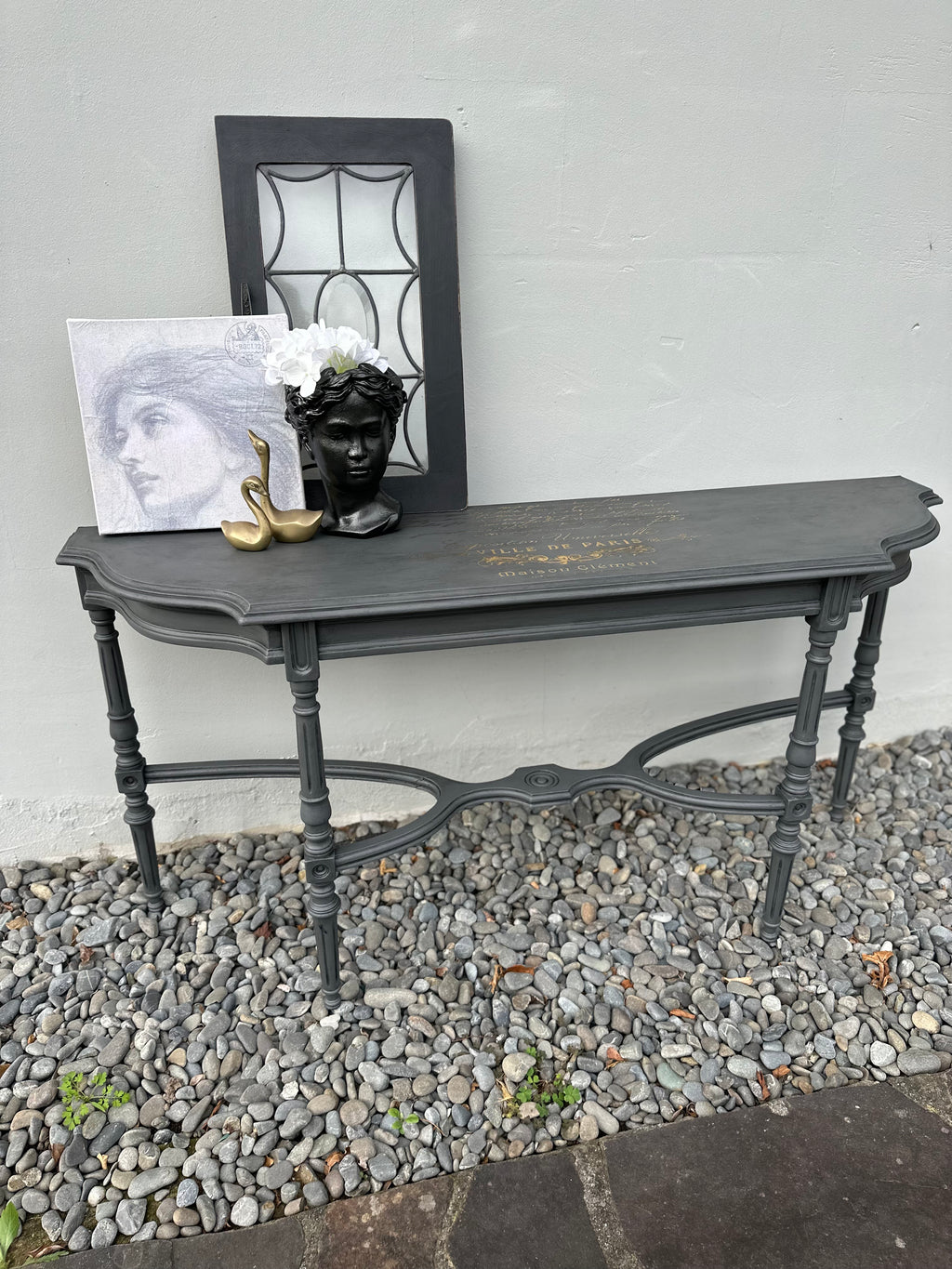 This delicate hall table is a slim width with very detailed legs. We amped this up with some gold foil scrip on top. Totally bespoke.  Dimensions 320mm depth x 1200mm length x 610mm height