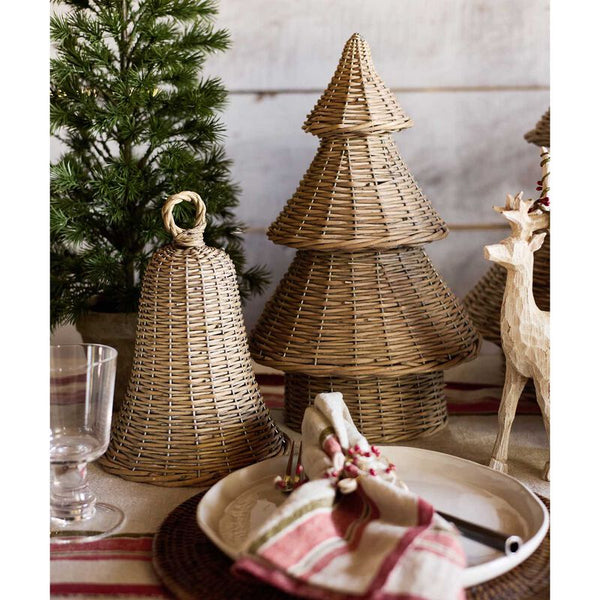 Wicker Christmas tree decorations on a table with a glass and striped cloth. French Country Willow Christmas Tree